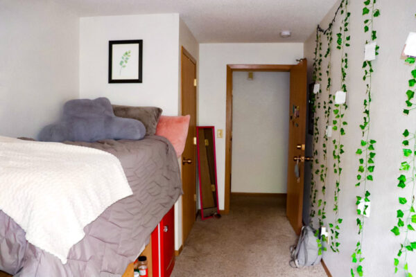 A private bedroom with a lofted bed and storage underneath in East Lake Apartments.