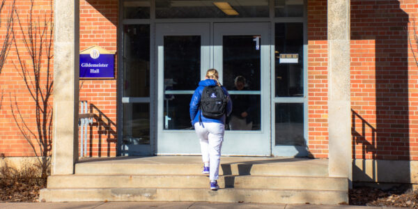 A student enters Gildemeister Hall on the WSU campus in Winona.