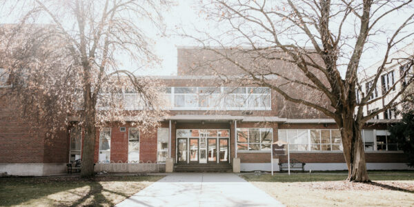 The exterior of Memorial Hall on a sunny spring day on the WSU campus in Winona.