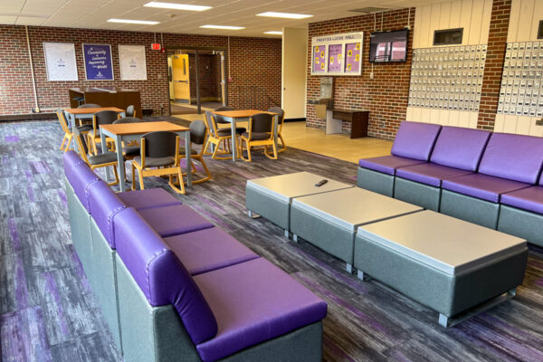 A lounge with many tables, chairs, and couches in Prentiss-Lucas Hall.