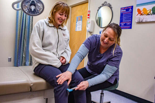 A nurse performs an exam on a student in Health Services on the WSU campus.