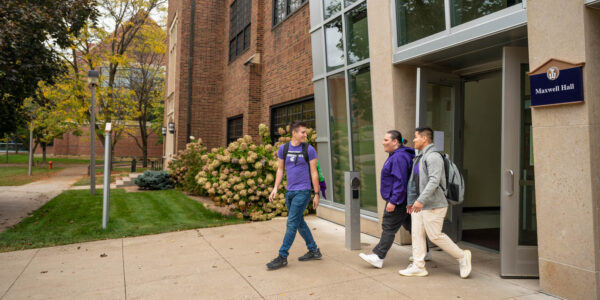 Three students exit Maxwell Hall on the WSU campus in Winona.