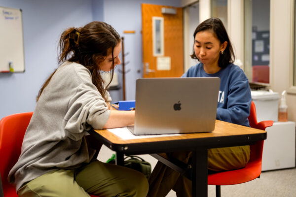 A student works with a tutor in the WSU Writing Center.