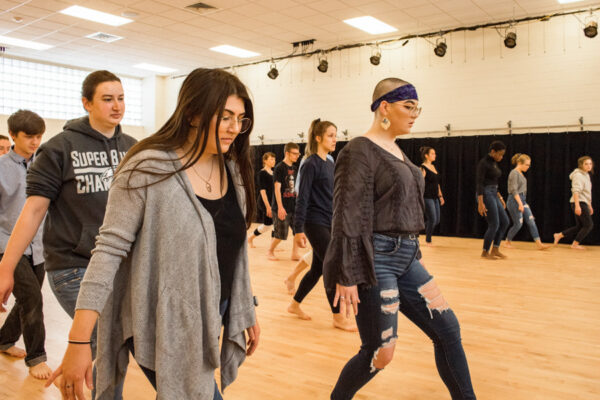 Students practice a dance routine in the dance studio in Memorial Hall.