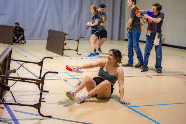 Students play with Nerf guns during a campus event in the Talbot Gym.