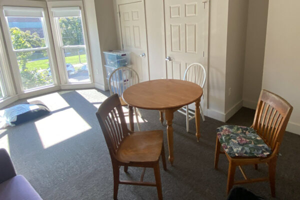 A study room in the WSU Sustainability House with a table and chairs.